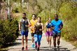 © ALTO IMAGES/Stocksy - Multiethnic Male And Female Athletes Running On Street