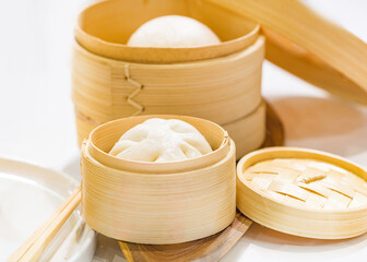 Sticker - Chinese dumpling steamed buns, Steamed bun served in wooden basket