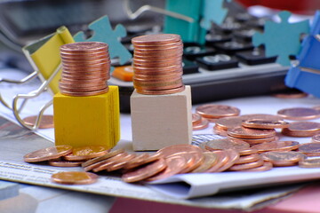 stack of golden coins on black background and advertising coins of finance and banking,increasing columns of gold coins on table