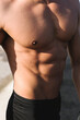 © simon/Stocksy - Muscular athletic bodybuilder detail