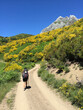 © Sky-Blue Images/Stocksy - Hiker walking on a trail on Picos de Europa