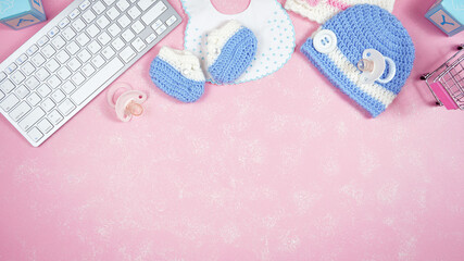 Wall Mural - Baby nursery clothing mom bloggers desktop workspace with pink and blue accessories on stylish pink textured background. Top view blog hero header creative composition flat lay. Negative copy space.