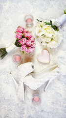 Wall Mural - White aesthetic wedding bridal theme desktop workspace with high heel shoes, bouquets and accessories on stylish white textured background. Top view blog hero header creative composition flat lay.