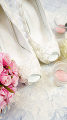 Wall Mural - White aesthetic wedding bridal theme desktop workspace with high heel shoes, bouquets and accessories on stylish white textured background. Top view blog hero header creative composition flat lay.