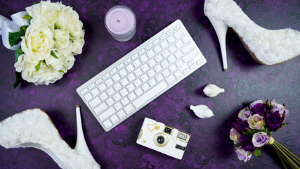 Wall Mural - Wedding bridal theme desktop workspace with high heel shoes, bouquets and accessories on vintage purple textured background. Top view blog hero header creative composition flat lay.