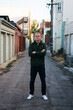 © Jesse Morrow/Stocksy - portrait of middle aged male in urban alley way city