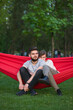 © Ibex.media/Stocksy - Young couple relaxing and having fun together in the park