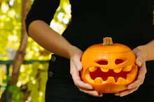 Hand Holding A Halloween Pumpkin