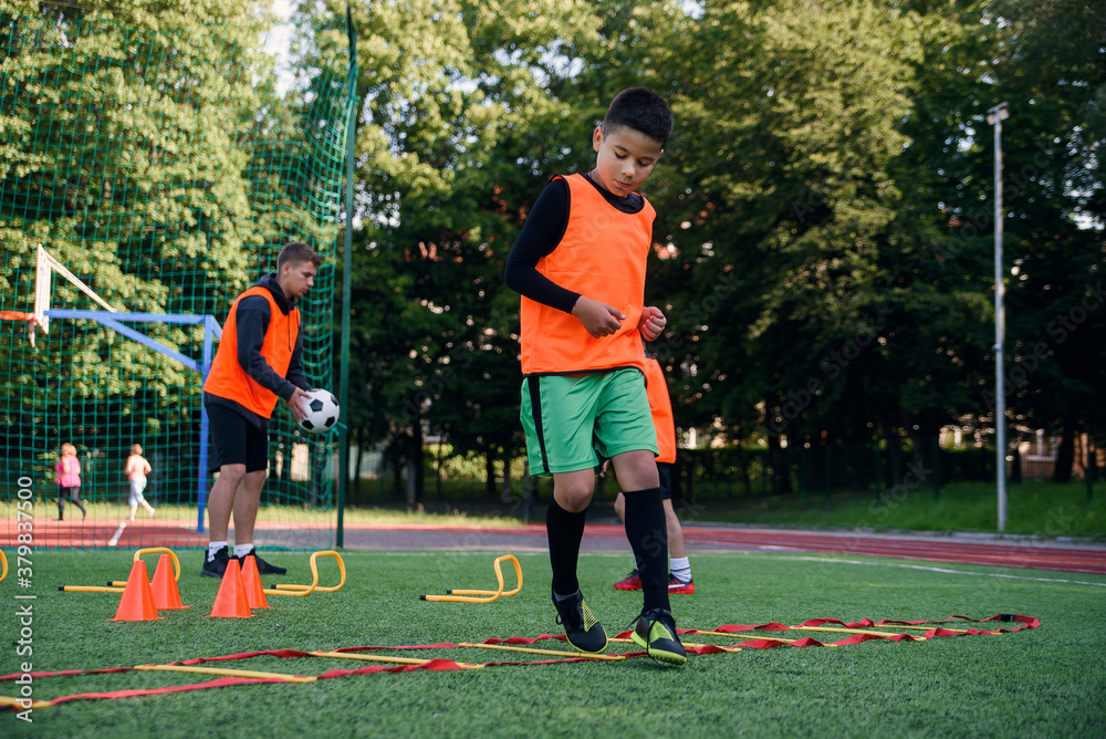 Young Footballer Routine Children's football players during team training before an important ...