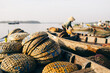 © Gary Radler Photography/Stocksy - Fish Market Baskets on a Canoe