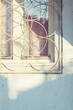 © Marija Savic/Stocksy - Close up of an old window in morning light.