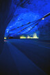 © Sky-Blue Images/Stocksy - Futuristic tunnel with blue neon lights, LÔøΩ_rdalstunnelen, Norway