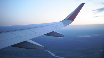 Wall Mural - airplane wing in flight view from the window. the concept of travel