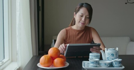 Sticker - Woman use of tablet computer at home