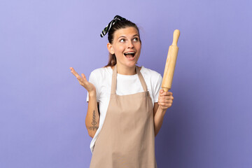 Cooker Slovak woman isolated on purple background with surprise facial expression