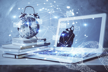 Desktop computer background in office and flying envelops hologram drawing. Double exposure. Electronic mail concept.