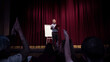 © master1305 - Talking to students. Male speaker giving presentation in hall at workshop. Business centre. Rear view of participants in audience. Conference event, training. Education, meeting, business concept.