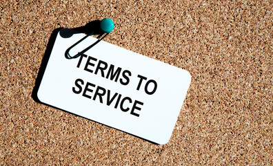 Leinwandbilder - On the card the inscription TERMS TO SERVICE, against the background of reports, pens.