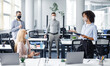 © Prostock-studio - Team building and teamwork during meeting. African american woman manager with tablet in hand gives tasks to workers in protective mask keeping social distance