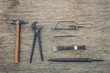 © Akela - from alp to alp/Stocksy - old rusty tools on wooden background