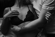 © Jess Craven/Stocksy - Young attractive couple in love cuddling in bed in bra and tshirt