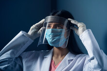 Female Doctor Wearing A Face Shield To Protect Herself From Coronavirus	