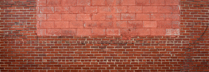 Wall Mural - Panorama of red brick with red painted concrete block insert, vignette urban background pattern, creative copy space, horizontal aspect