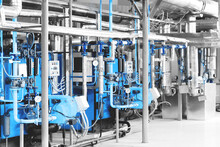 Interior Of Modern Industrial Gas Boiler Room With Two Gas Boilers And Pipes For Supplying Gas And Steam. Blue Toning