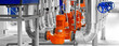 Modern industrial boiler room with pumps and pipe lines supplying steam with pressure gauges installed in. Panoramic banner.