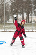 © Carleton Photography/Stocksy - Boy in snowsuit throws snowball