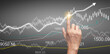 © violetkaipa - Hand touching  graphs of financial indicator  accounting market economy analysis chart
