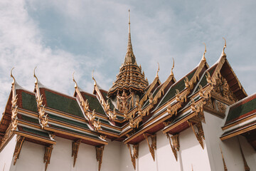 Low angle shot of the Wat Phra Kaew roof under the sunlight in Bangkok, Thailand