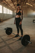 © Jacob Lund - Muscular female athlete at crossfit training gym
