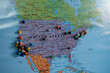 © RZCREATIVE/Stocksy - Pins in a map of North America.