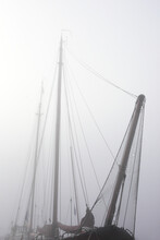 Old Boat In The Harbour On A Foggy Morning