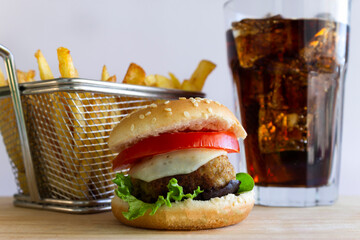 Cheeseburger with Fries and Cold Cola on Wood Board , on White Background.American fast food concept.