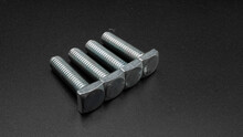 Galvanized Square Head Screws On A Green Background