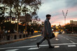 © BONNINSTUDIO/Stocksy - Young businessman walking on the street at night.