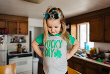 Toddler Child In Lucky Day Saint Patrick's Day Shirt In Kitchen.
