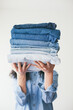 © VeaVea/Stocksy - Woman holding jeans