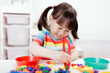© M-image - young girl play math and color sorting fine motor skill game for  homeschooling