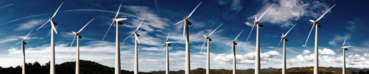 Renewable energy and wind turbines. Wind mills farm and sunset landscape.