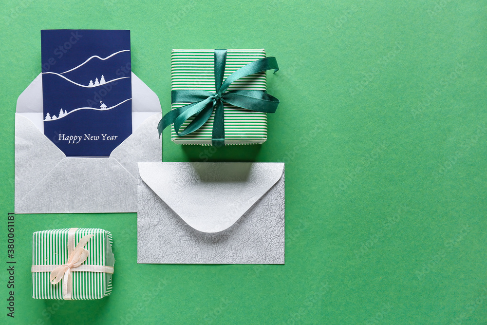 Beautiful composition with New Year greeting card on color background