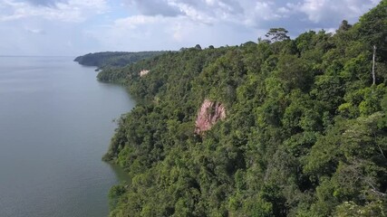 Wall Mural - Beautiful drone aerial view of Tapajos river landscape, hills and trees of Amazon rainforest in cloudy summer day. Concept of climate change, global warming, carbon, co2, conservation, ecology.