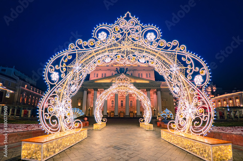 Bolshoi Theater in Moscow. Capital of Russia in winter evening. Christmas arches in center of Moscow. Travel through cities of Russia. Sights of Russian cities. Christmas in Moscow. New year Russia.