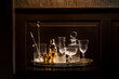 © Lior + Lone/Stocksy - Vintage glassware and bar gear on a bar table