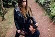 © Thais Varela/Stocksy - cool attractive couple posing in the forest