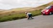 © kkgas/Stocksy - Motion blur of a longboarder being pursued by a camera car