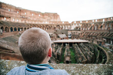 A Little Guy Looking Out Over The Inside Of The Colosseum