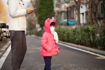 Mother with her daughter playing outdoors